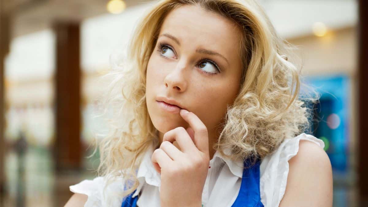 woman thinking blonde alone