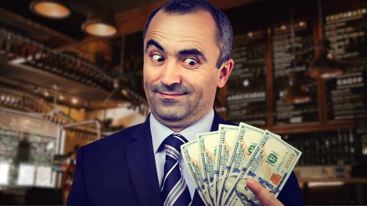 business man holding cash