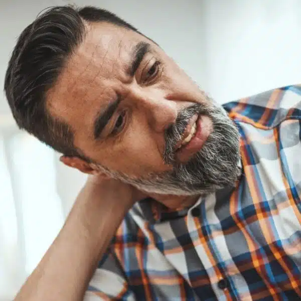 man stressed working at desk