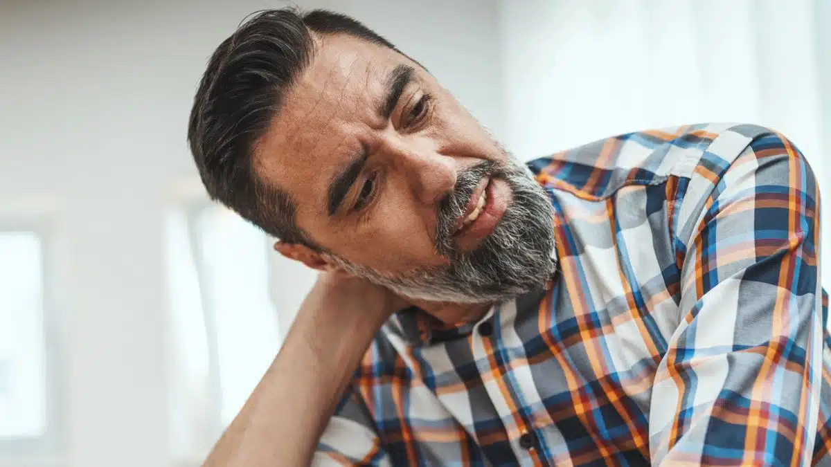 man stressed working at desk