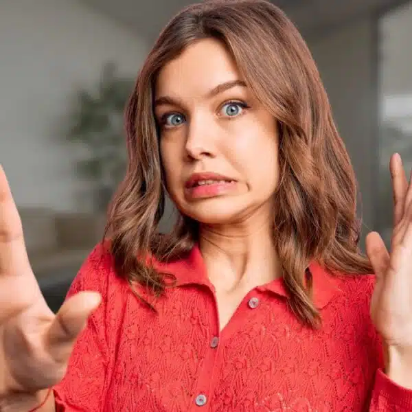 red sweater woman weird shocked face