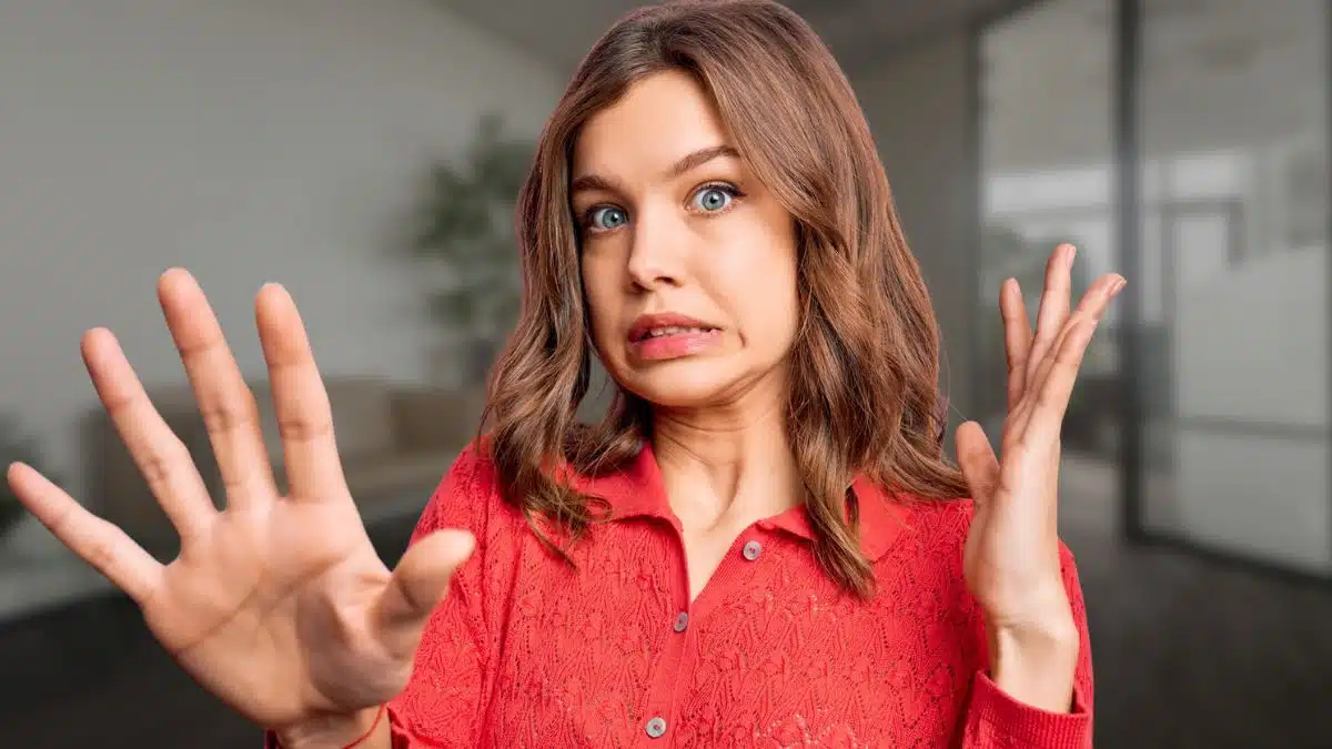 red sweater woman weird shocked face
