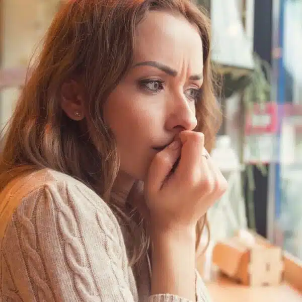 woman at coffee shop regret