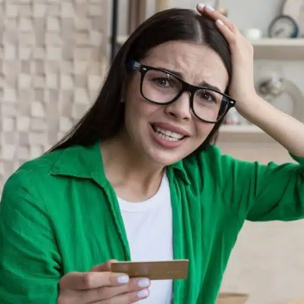 woman glasses at home credit card laptop