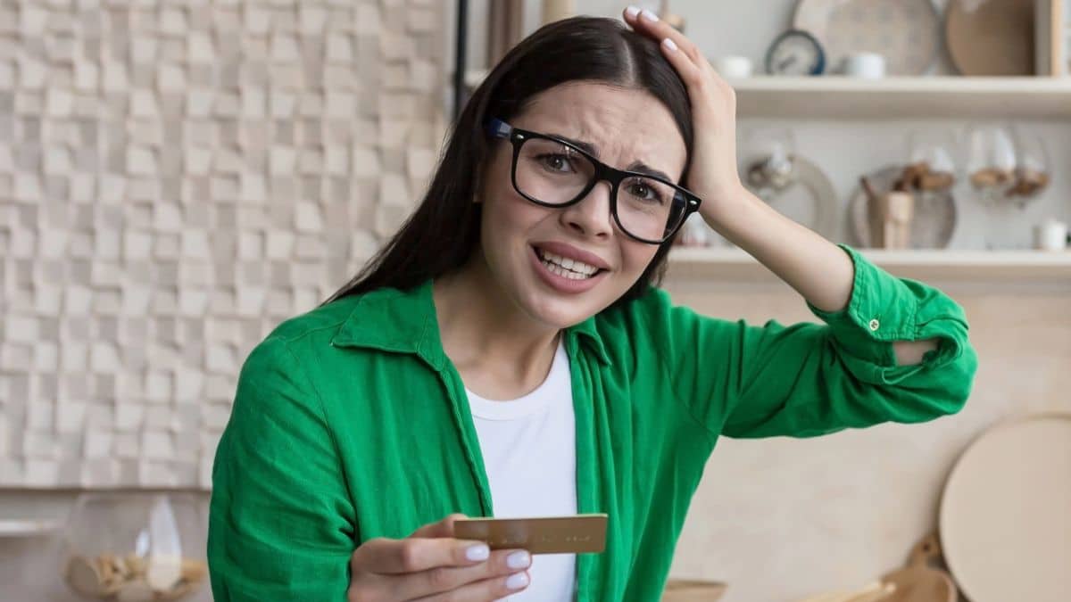 woman glasses at home credit card laptop