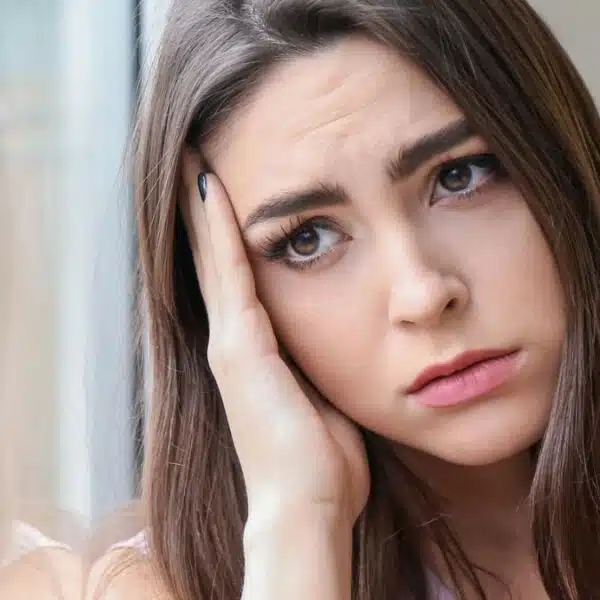 woman sad looking out the window