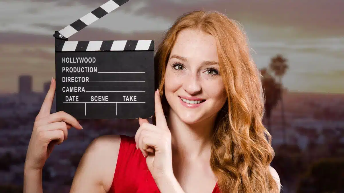actress holding up sign