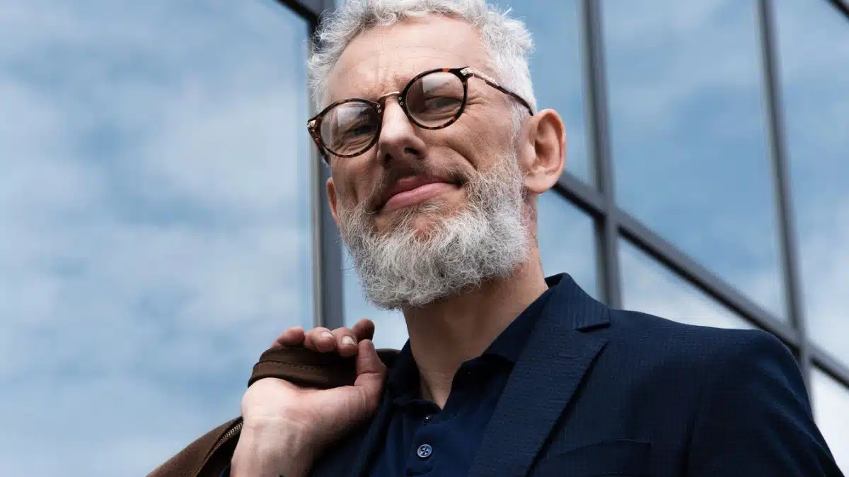 business man jacket beard glasses