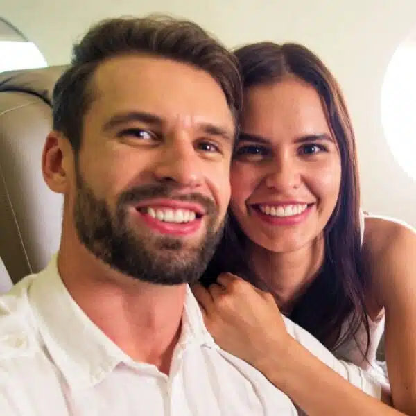 couple happy flying first class