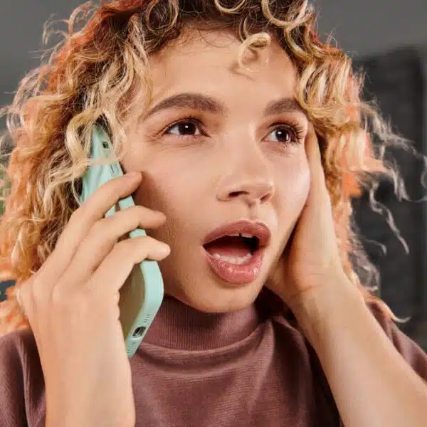 curly blonde phone shocked