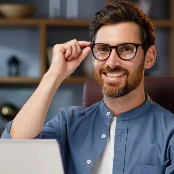 man beard glasses laptop