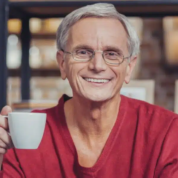 man red sweater coffee happy