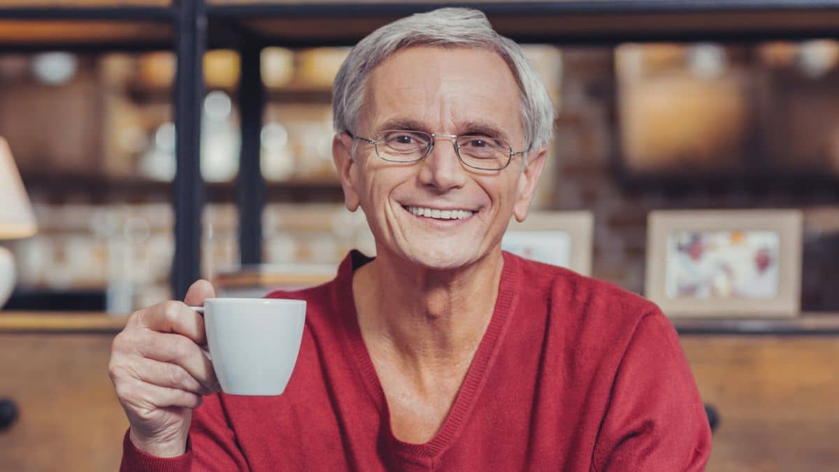 man red sweater coffee happy