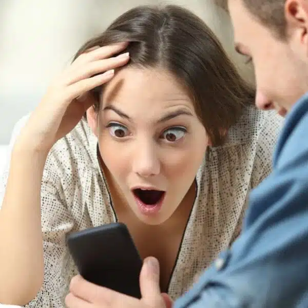 woman amazed looking at the phone