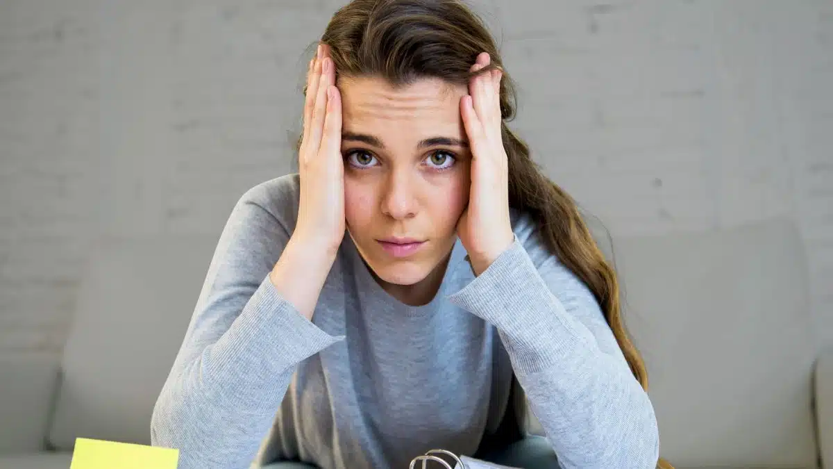woman bills stressed calculator