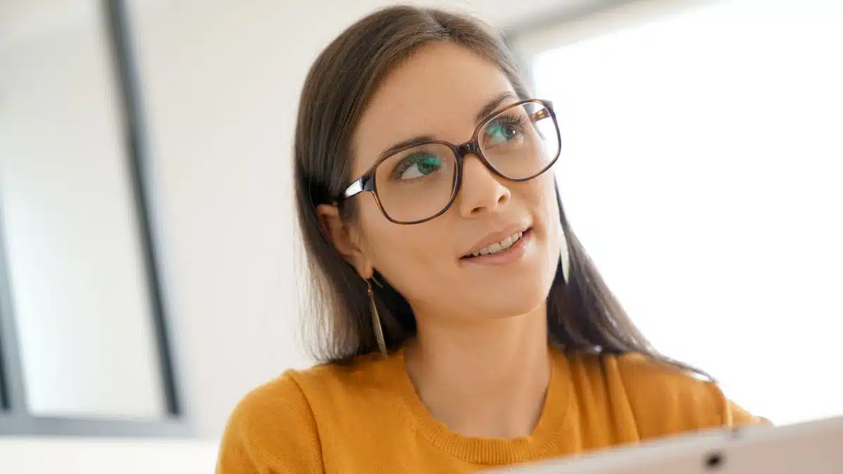woman glasses thinking orange