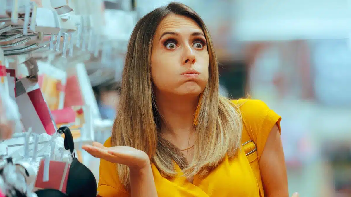 woman shocked at store buying stuff