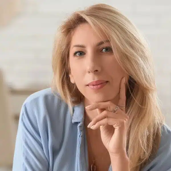 blonde woman thinking at home