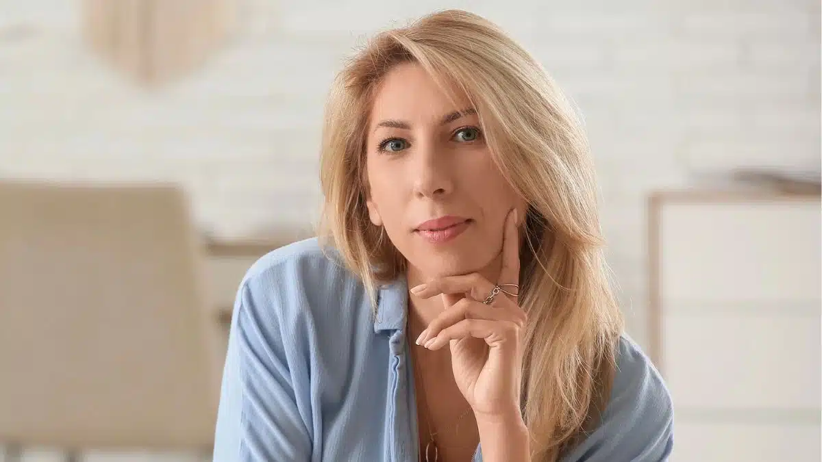 blonde woman thinking at home