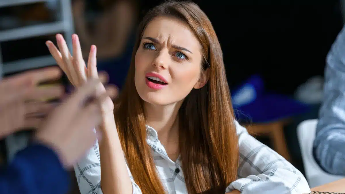 brunette woman upset at work