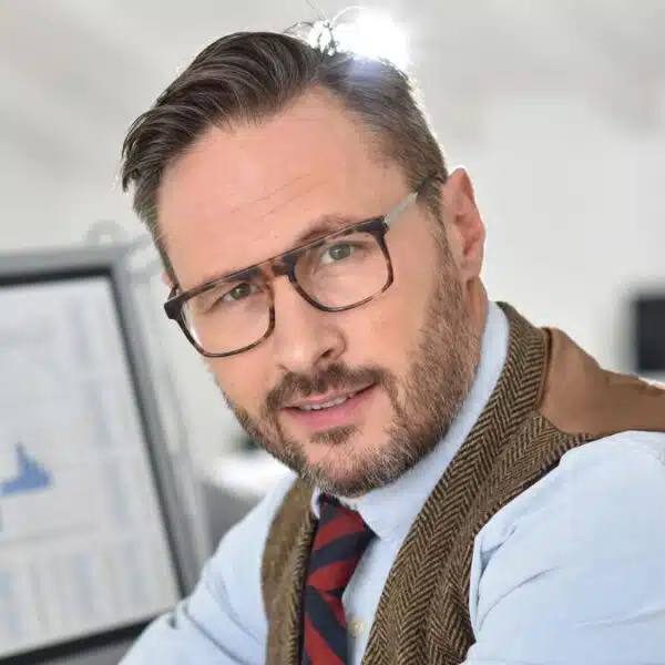 businessman glasses in front of laptop