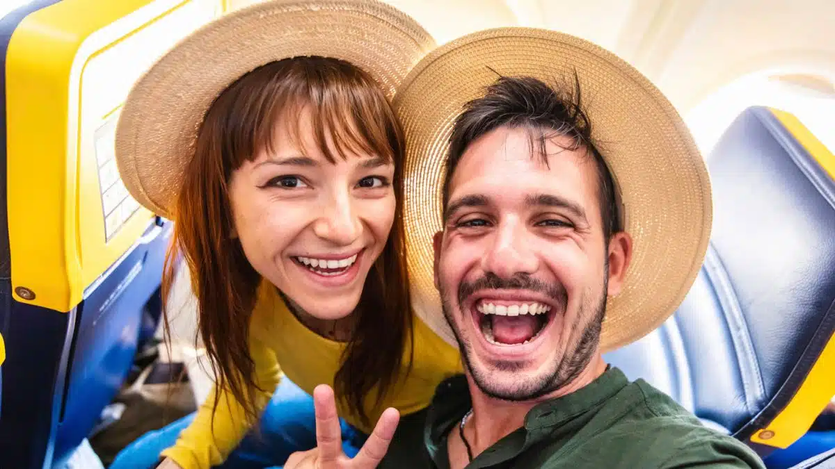 couple smiling on airplane