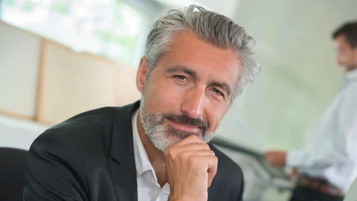 mature man beard smiling thinking