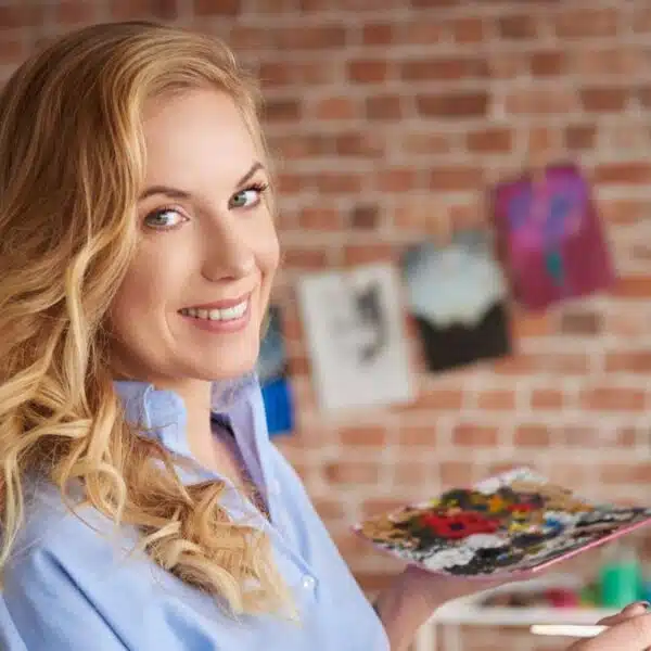 woman painting in a building