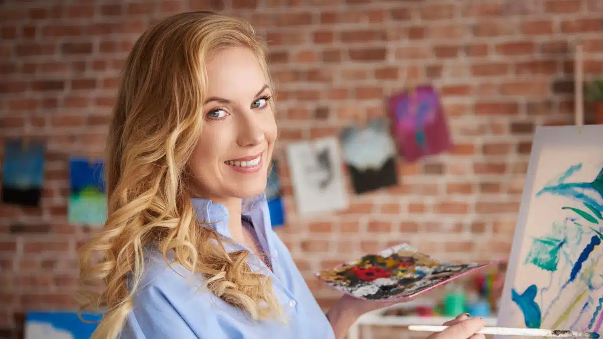 woman painting in a building