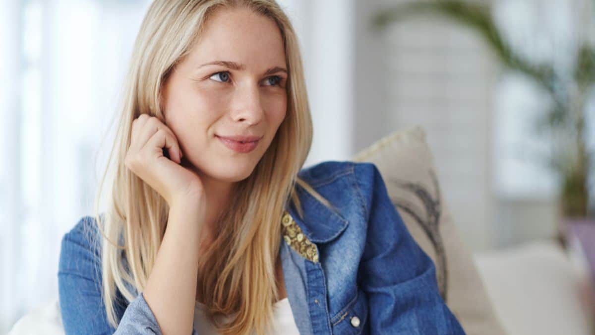 woman sitting at home thinking
