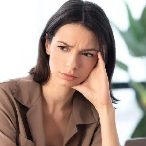woman sitting in a office thinking