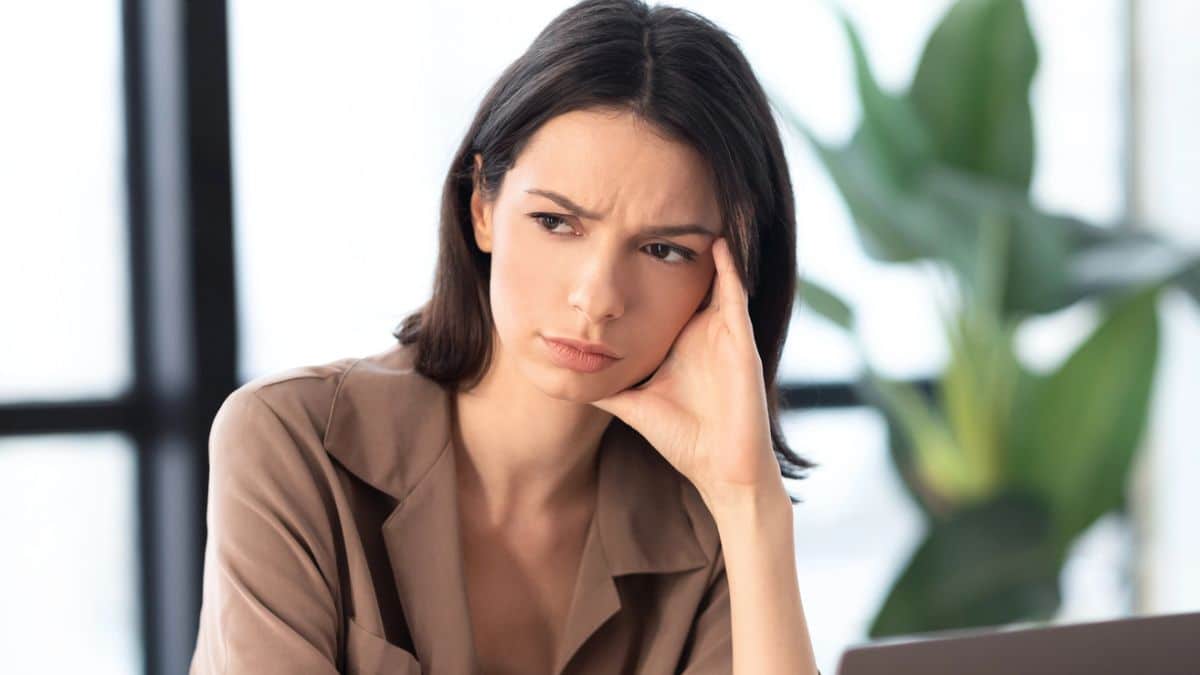 woman sitting in a office thinking