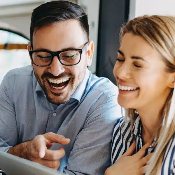 friends laughing with tablet