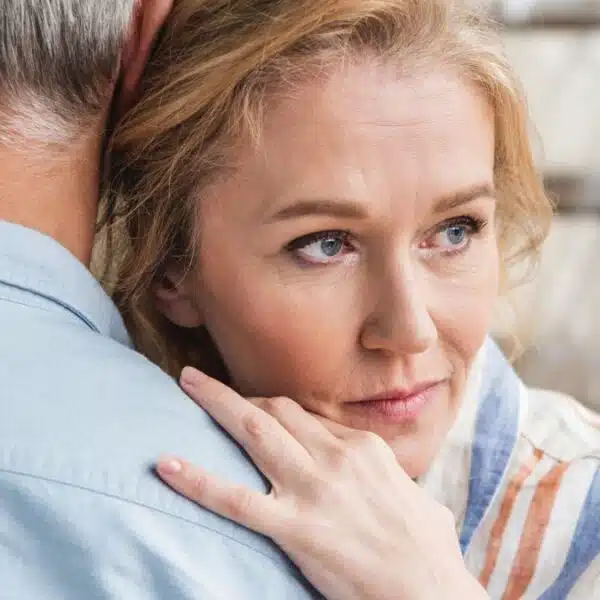 mature couple hugging at home