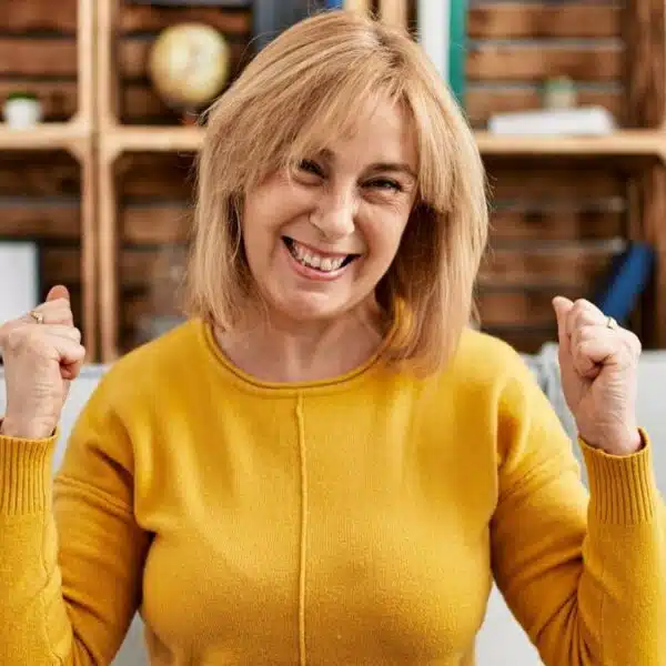 mature woman happy on couch