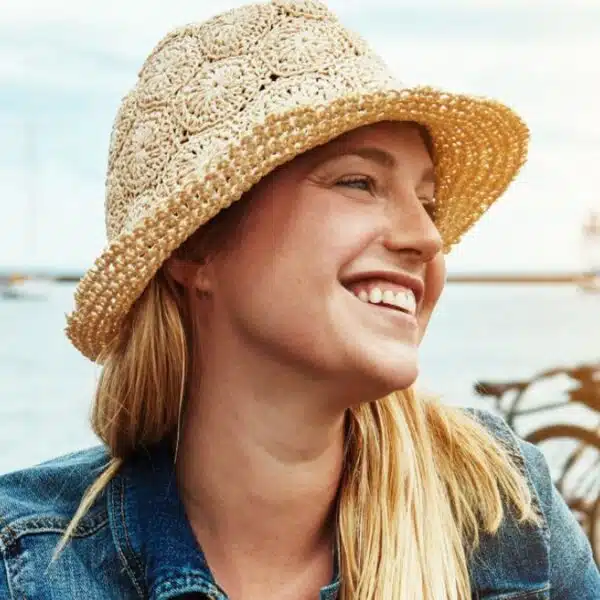 woman biking hat outside smile
