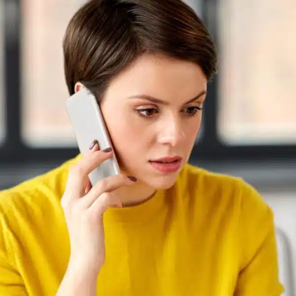 woman on phone scared