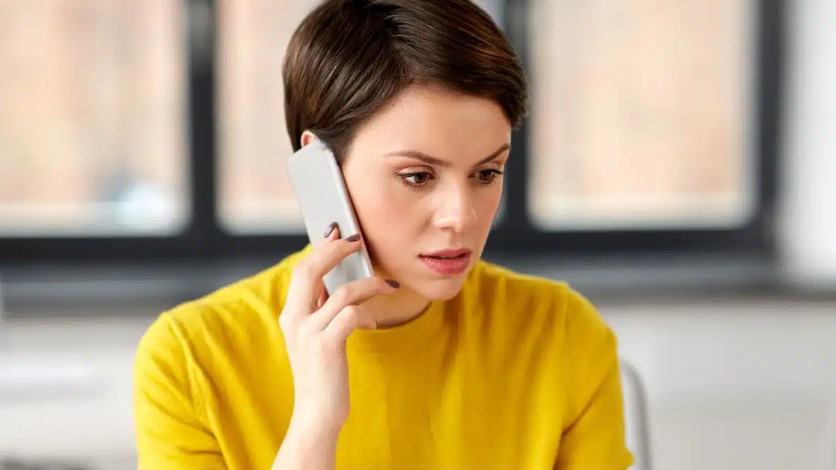 woman on phone scared