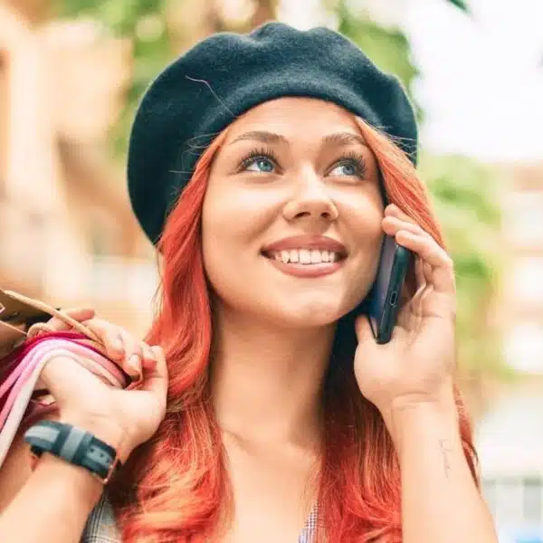 woman on phone wearing hat