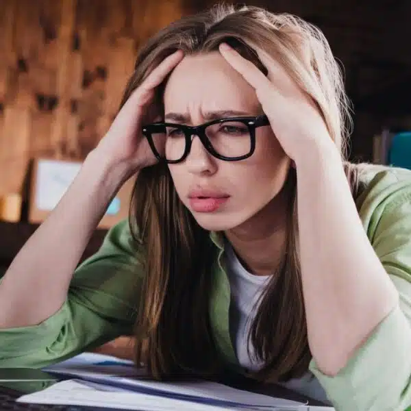 woman stressed at her desk not happy