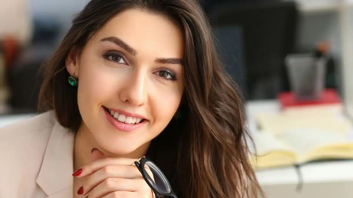 woman working in the office with glasses
