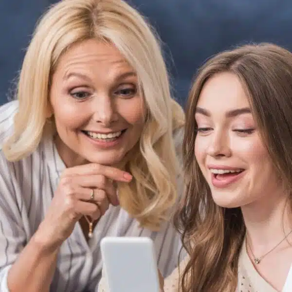 women family laughing tablet