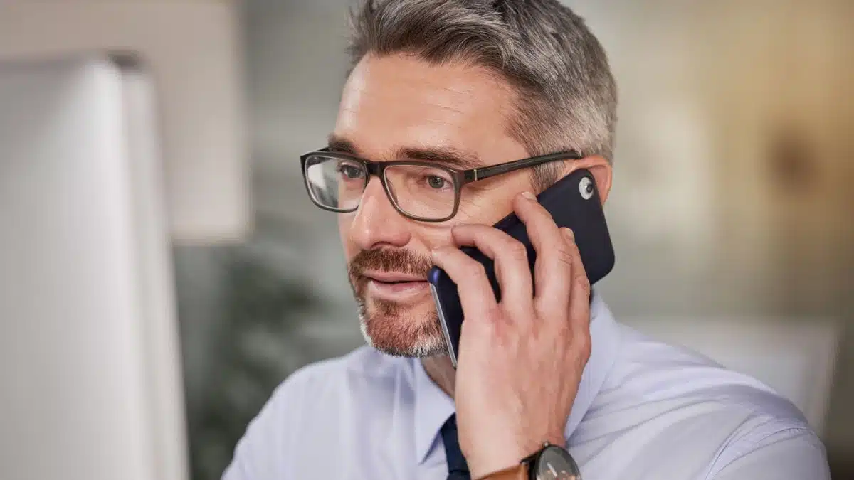 Man reviewing his accomplishments at work