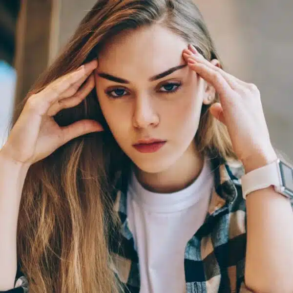 Woman stressed reviewing her finances