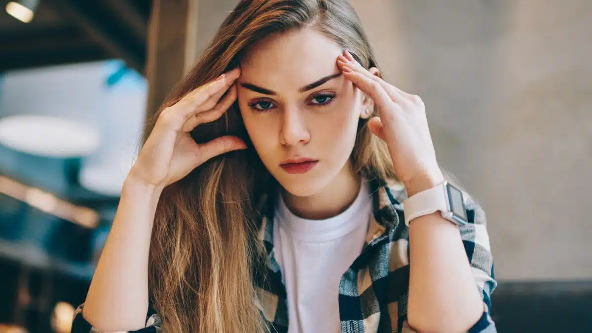 Woman stressed reviewing her finances