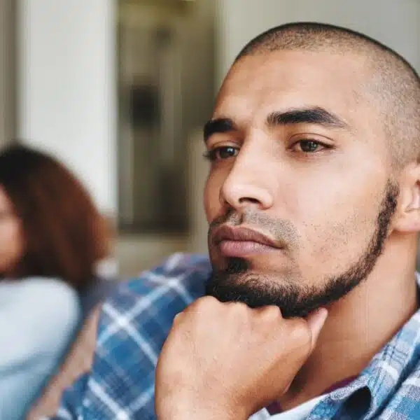 man with beard thinking