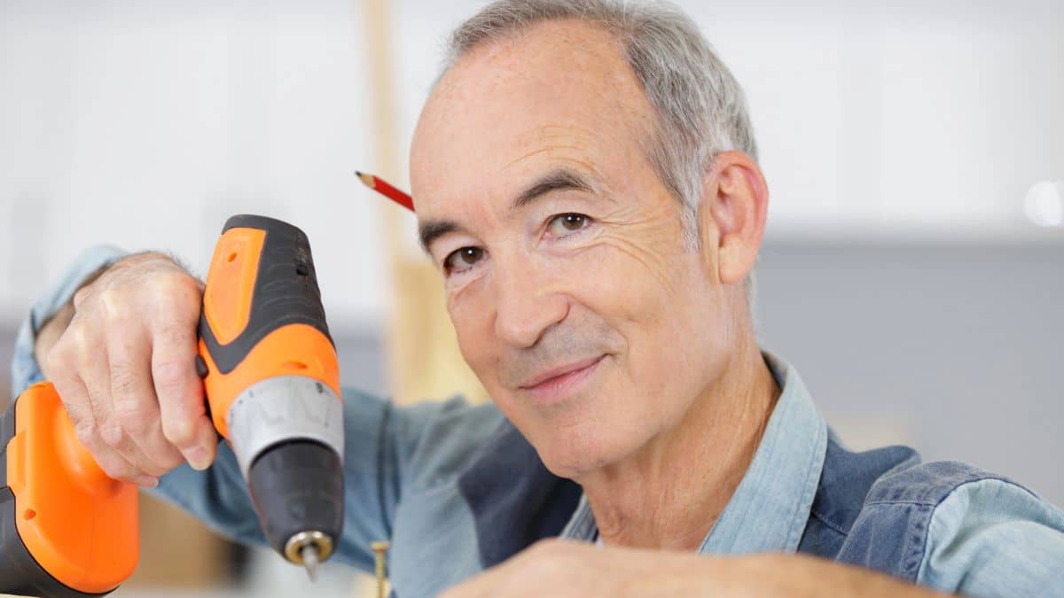 senior man with a drill