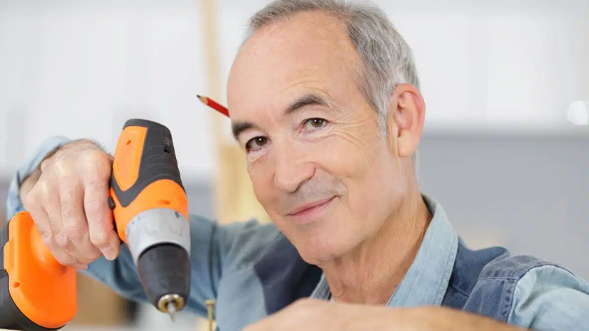 senior man with a drill