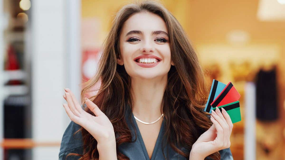 woman holding a credit card shopping