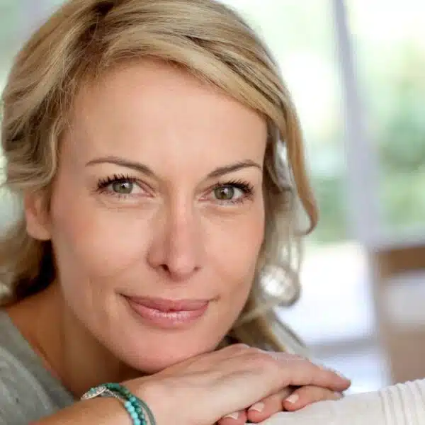 woman on couch smiling